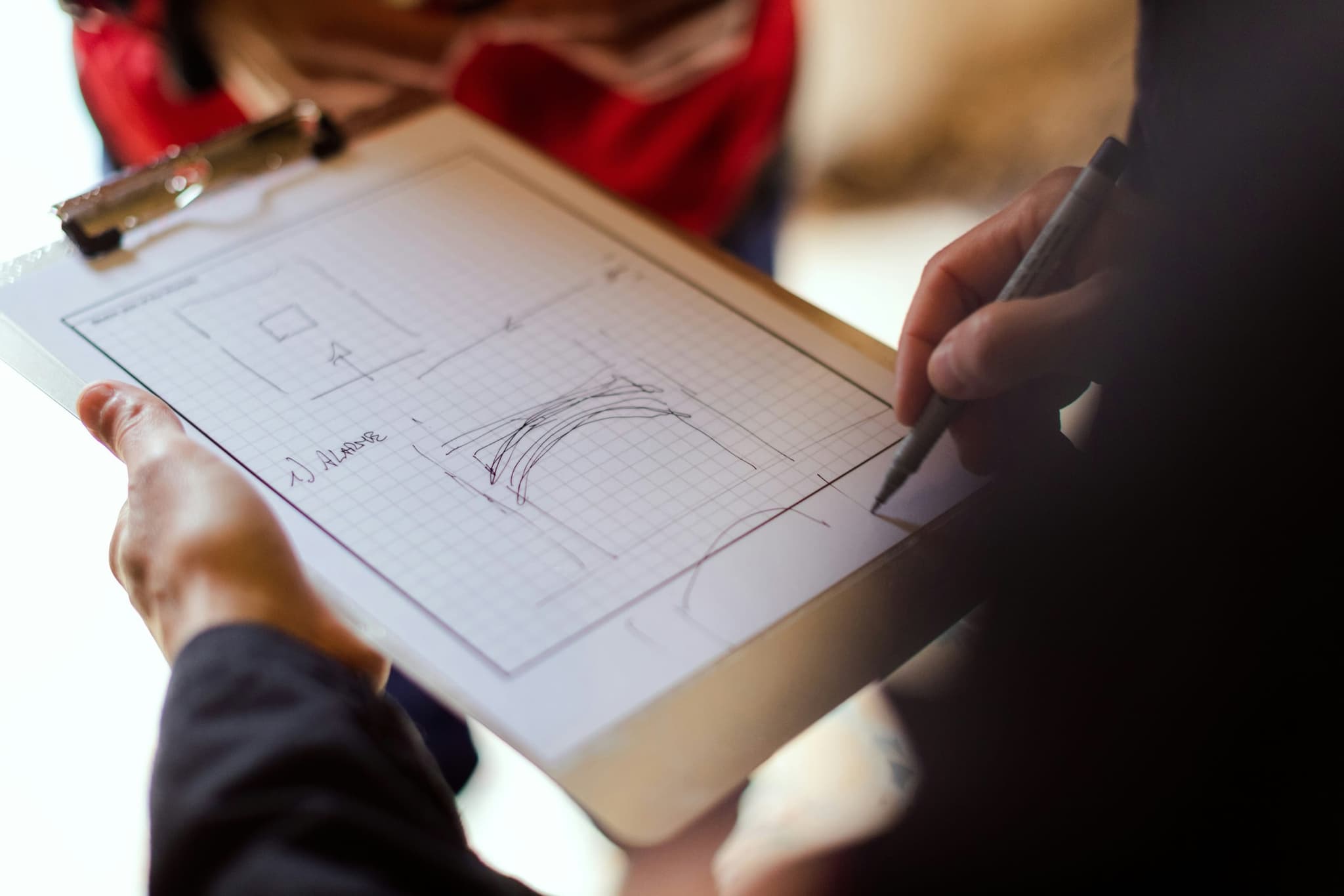 A room sketched out on squared paper by hand, one element at a time